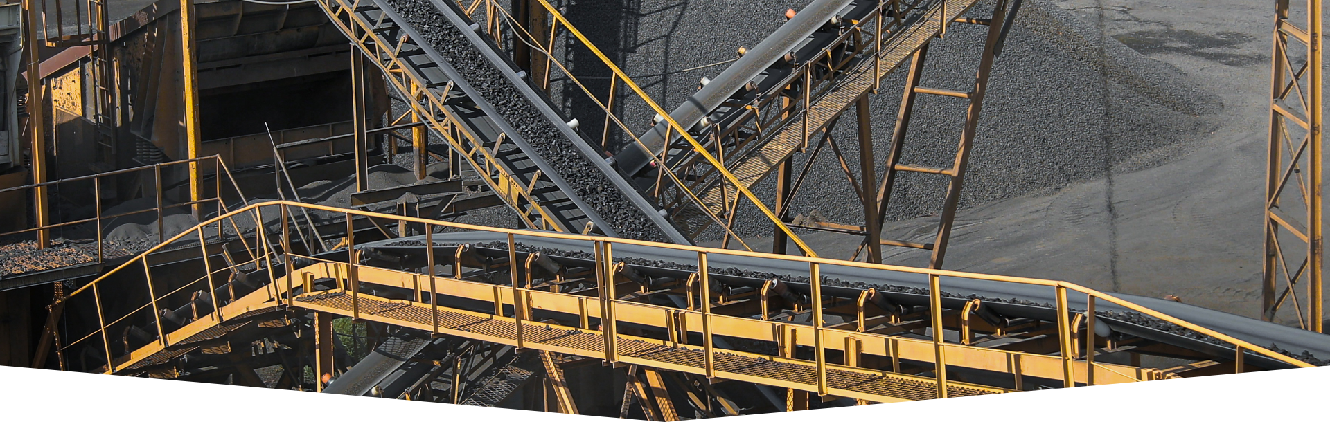 Conveyor belts in a mining operation by Dhiyohouse Inc, showcasing the role of conveyor belts in mining operations.